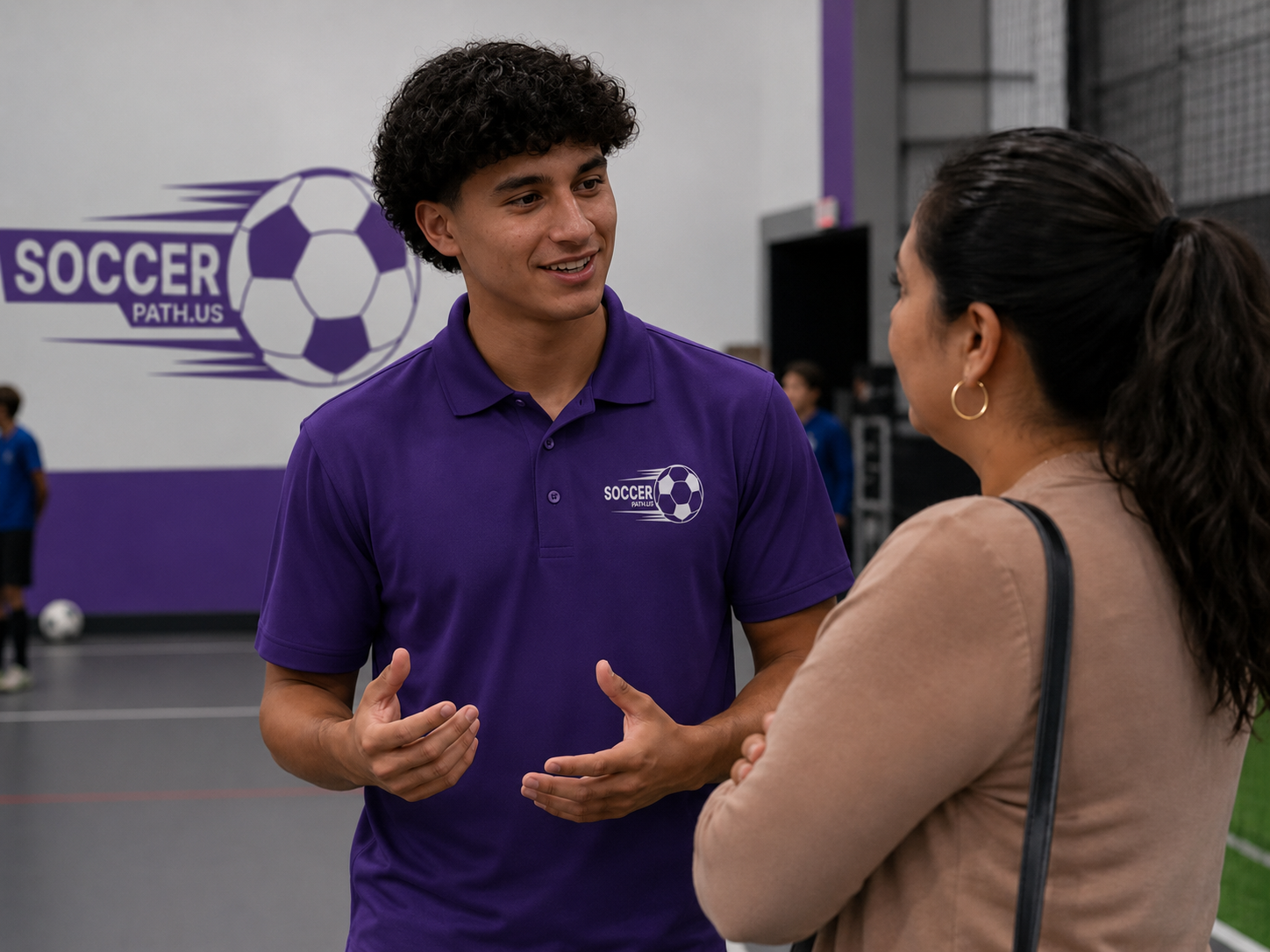 SoccerPath advisor speaking with a parent at a soccer facility